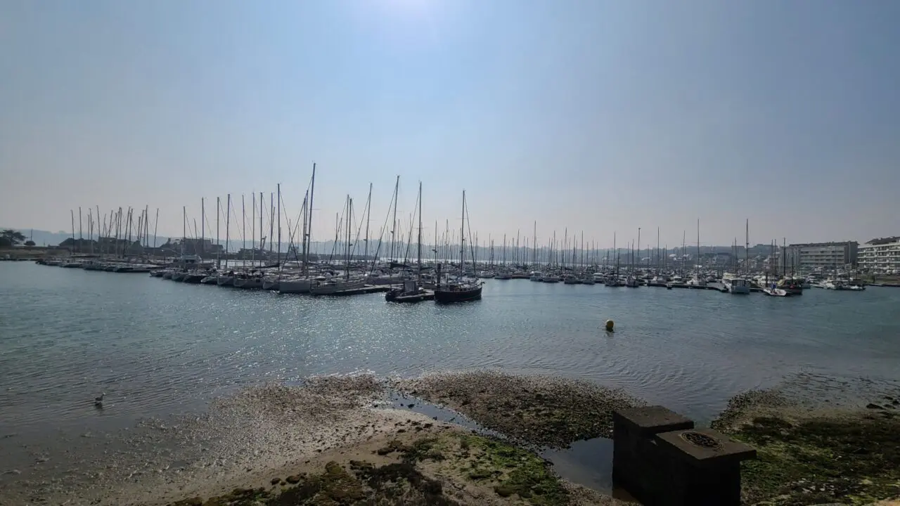 Wide view of Port de Plaisance marina in Perros-Guirec showing hundreds of yachts and boats docked at the harbor