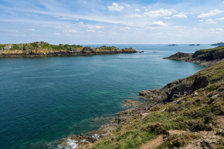View of Île des Landes uninhabited island bird sanctuary from Pointe du Grouin showing pristine coastal waters and rocky outcrops near Cancale, Brittany