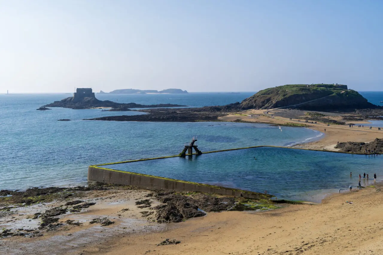 View of Grand Bé and Petit Bé islands beyond the seawater pool in Saint-Malo with tidal causeway visible